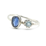 Oval faceted Blue Kyanite ring in silver bezel setting with round blue topaz on sterling silver hard texture band