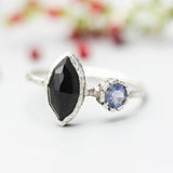 Marquise faceted Black Onyx ring with Blue sapphire on sterling silver hard texture band