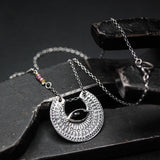 Crescent moon necklace with marquise black onyx in silver bezel setting