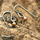 Rose gold bead earrings with oxidized sterling silver hooks - Metal Studio Jewelry